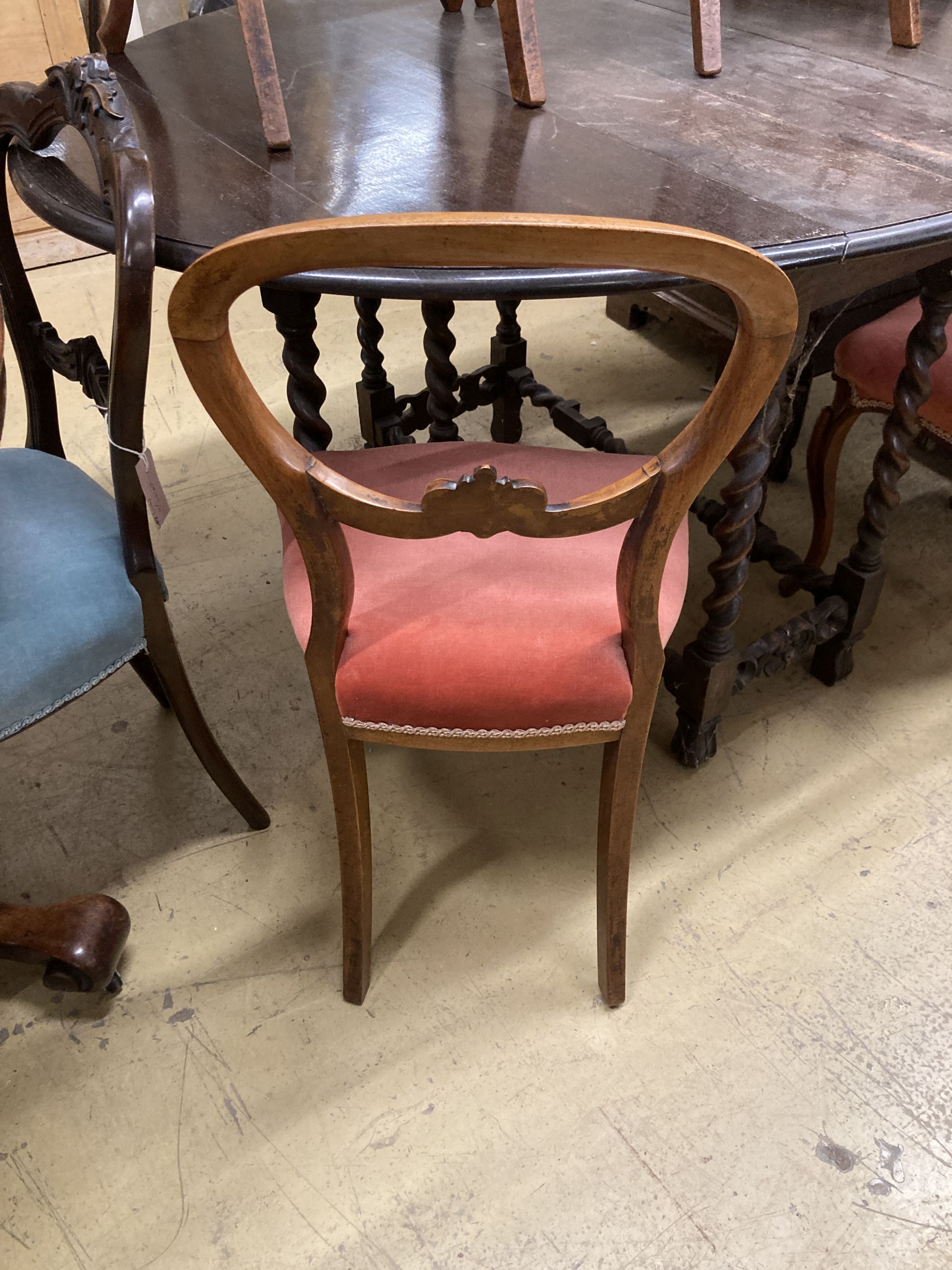 A set of four Victorian mahogany balloon back dining chairs